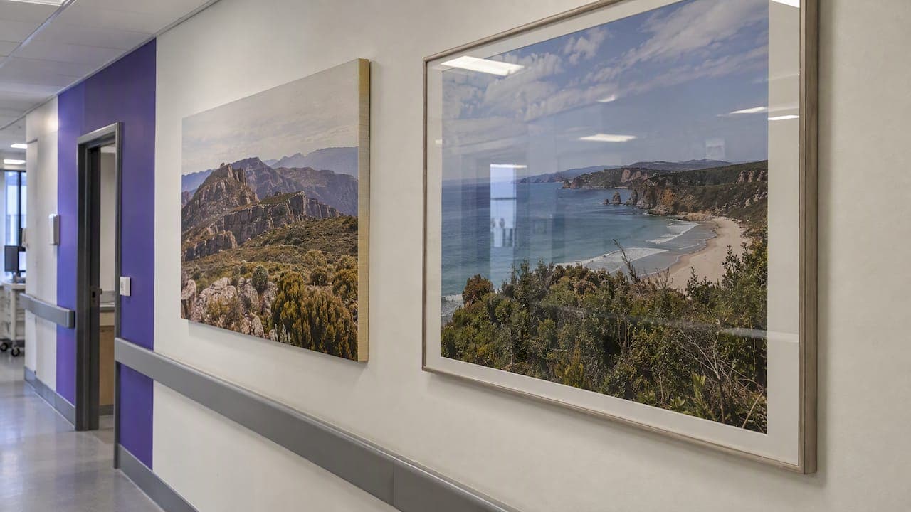 Healthcare Wall Art in Australia: Why Raw Canvas and Glass Pose Risks